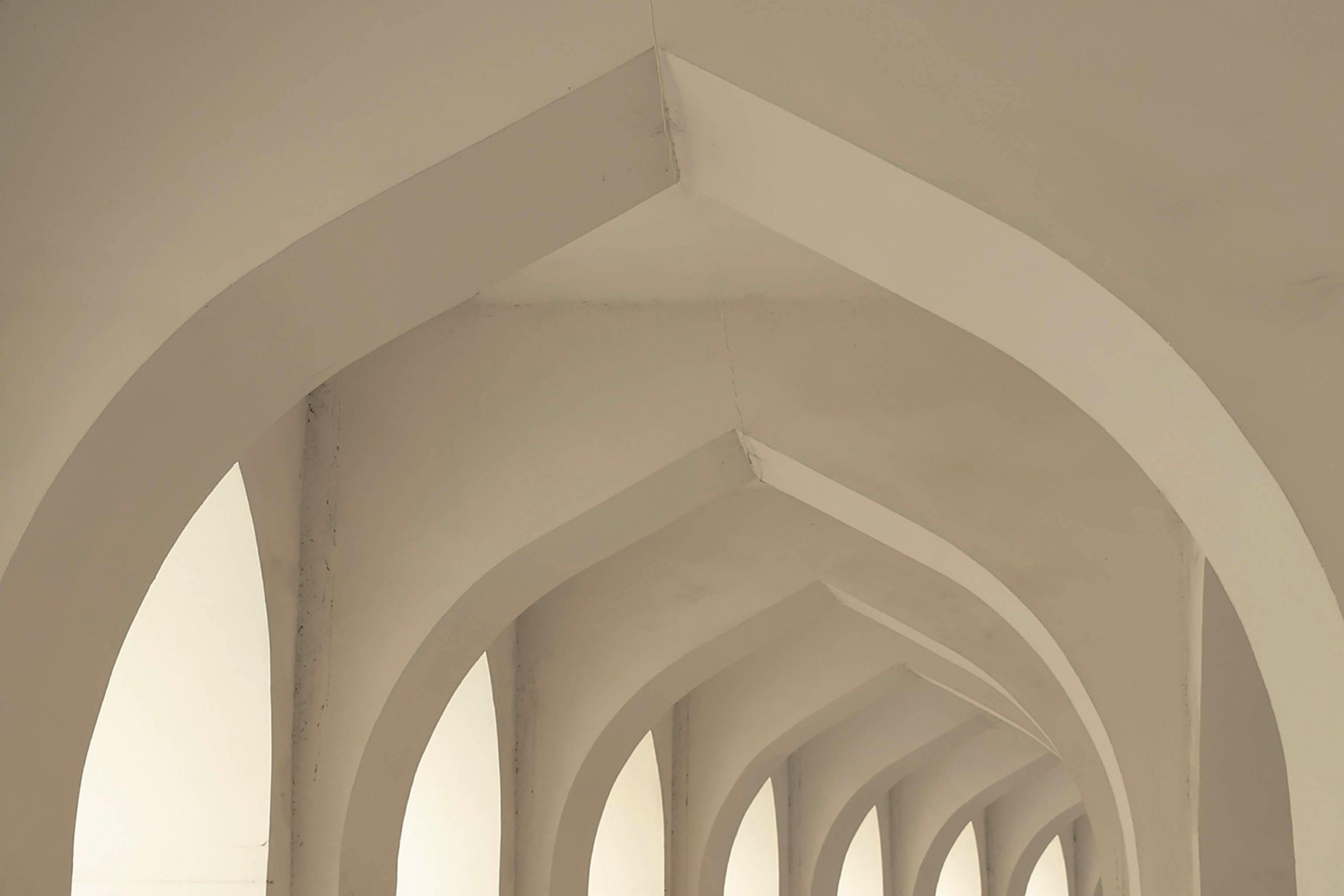 Captivating view of symmetrical architectural arches in a modern interior setting.